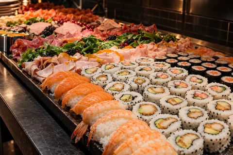 A buffet of sushi and small bites