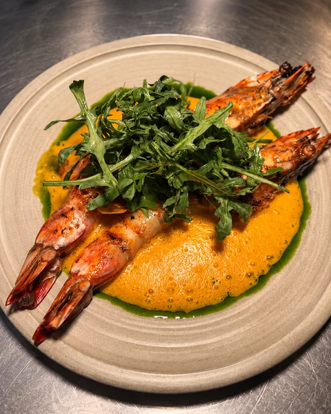 Grilled prawns with greens and a golden purée